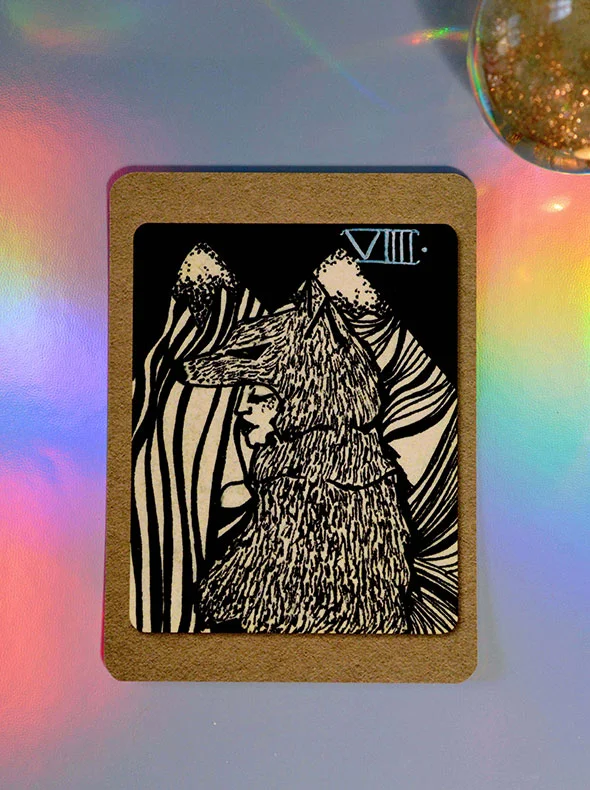 carte de jeu de tarot avec une illustration d'une femme louve